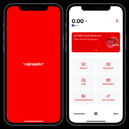 Two smartphones displaying the Aircash mobile app interface. The phone on the left shows the red Aircash splash screen with the logo in white. The phone on the right displays the main dashboard of the app with a balance of 0.00 Euros. Below the balance, there's a banner promoting a free Aircash Mastercard. The screen also shows six action buttons: Deposit, Withdrawal, Send, Marketplace, Aircash Mastercard, and Scan and Pay. At the bottom are three navigation buttons labeled Transactions, a QR code icon, and Menu. Filippos Fragkogiannis