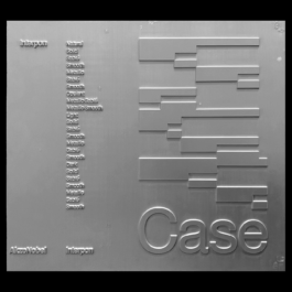 A metallic silver panel with embossed text and geometric patterns. The word 