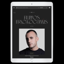 A tablet displaying the Awwwards website, featuring Filippos Fragkogiannis as a jury member for 2023. The webpage has a dark background with elegant, modern typography showcasing his name. Below the text is a centered portrait of Filippos Fragkogiannis, a graphic designer and art director from Greece, wearing a black shirt against a neutral backdrop. Filippos Fragkogiannis