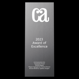 Communication Arts Award of Excellence trophy crafted from solid aluminum with a sleek brushed-metal finish. The top features the 